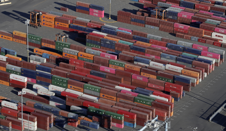 Cargo containers are staged near cranes at the Port of Tacoma in Washington.