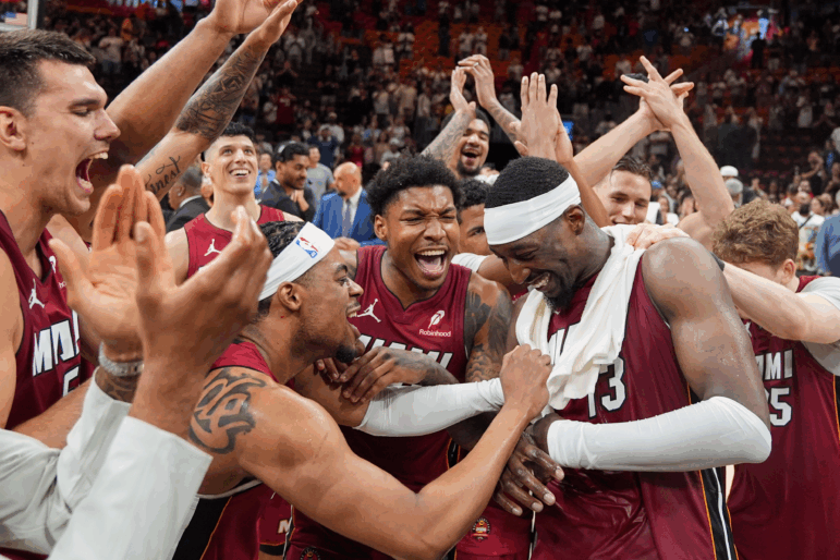 Miami Heat teammates celebrate center Bam Adebayo (13) after he scored 83 points, the second-highest single game total in NBA history, in an NBA basketball game against the Washington Wizards, Tuesday, March 10, 2026, in Miami.