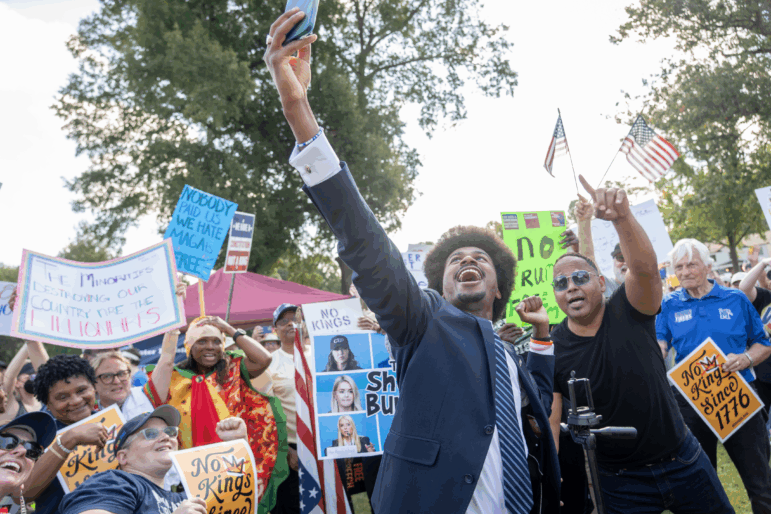 Tennessee State Representative, Justin Pearson, takes a selfie with protesters at a "No Kings" protest on October 18, 2025 in Memphis, Tenn. Pearson is looking to unseat his former boss, Rep. Steve Cohen.