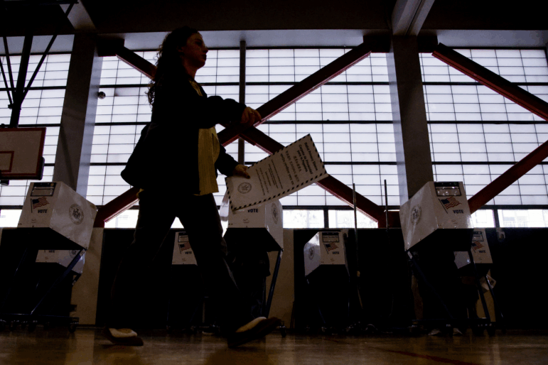 People vote at a polling location in Queens during New York City's mayoral election on Nov. 4, 2025.