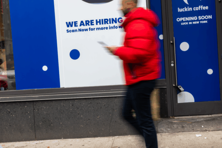 NEW YORK, NEW YORK - JANUARY 09: A 'now hiring' sign is displayed in a business's window in Manhattan on January 09, 2026, in New York City. The Labor Department reported on Friday that employers added 50,000 jobs in December, bringing the unemployment rate down to 4.4% (Photo by Spencer Platt/Getty Images)