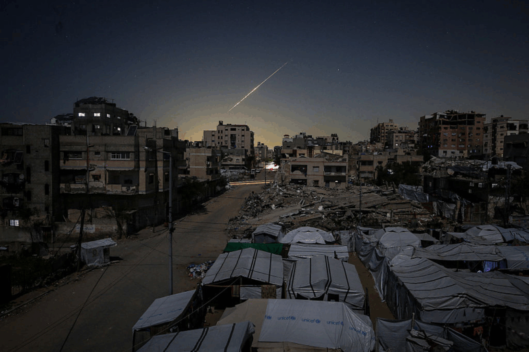 Iranian rockets heading toward Israel are seen crossing the sky over Gaza City on March 3, 2026, as they travel toward Israeli territory amid escalating regional tensions.
