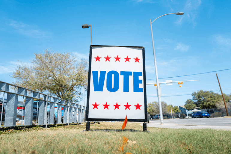 A "VOTE" sign is posted near a polling center on Tuesday in Austin, Texas. Texas held primary elections including two hotly contested races for Democratic and Republican Senate nominations.