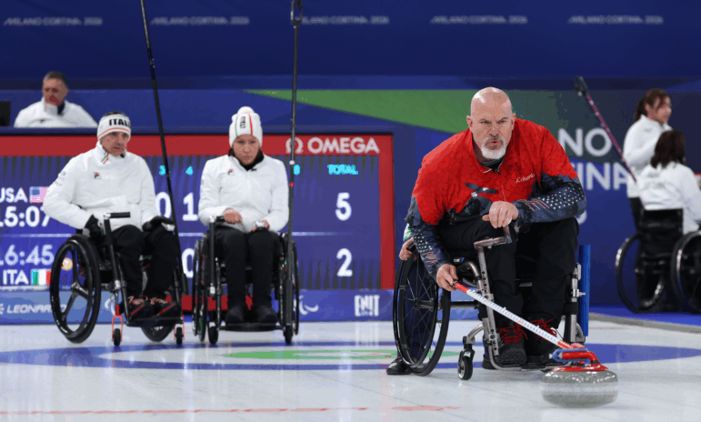 American Steve Emt competes in Sunday's mixed doubles match against Italy, which the U.S. won.